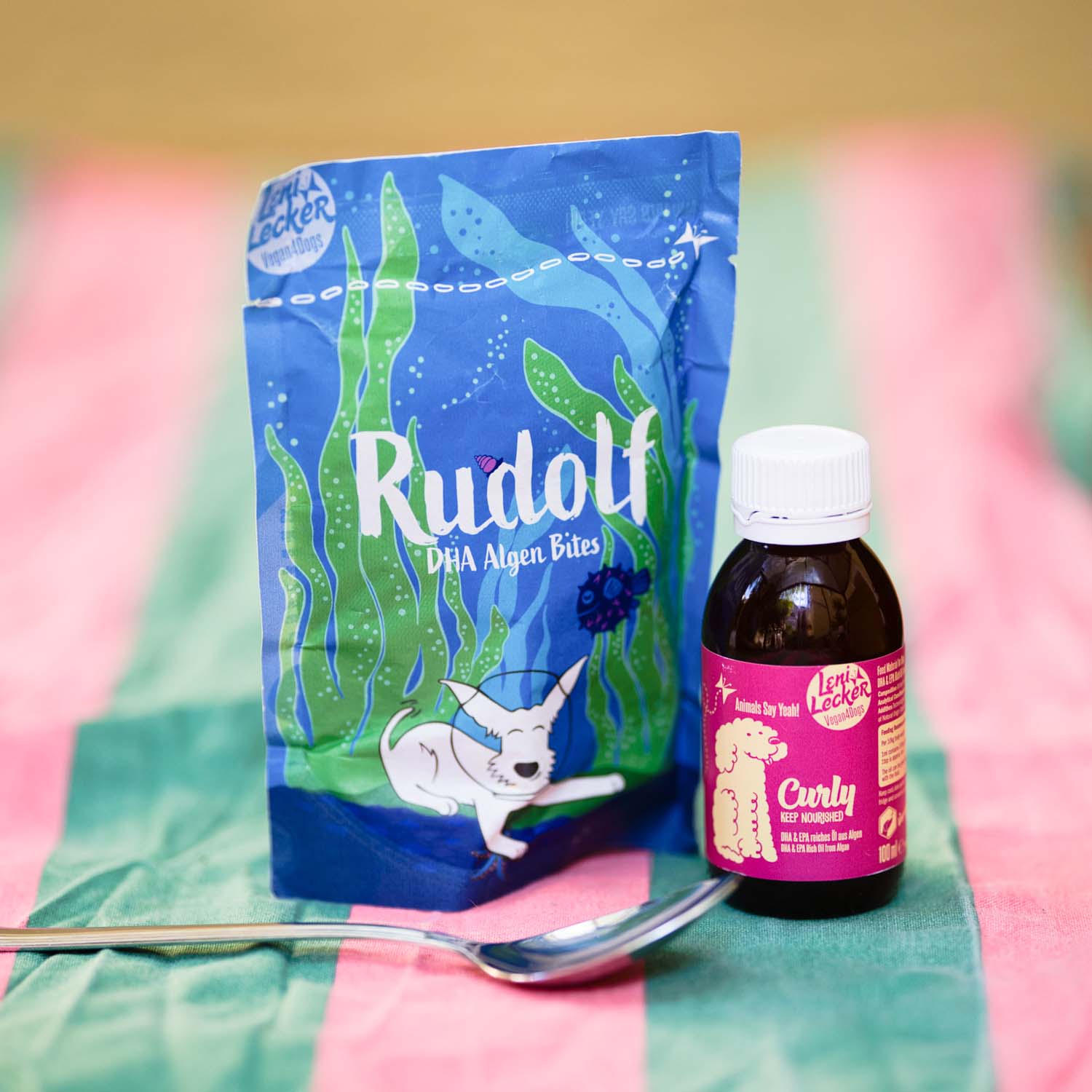Vegan4Dogs bundle featuring Curly Omega-3 Algae Oil and Rudolf DHA Algae Bites for dogs, arranged in an attractive display